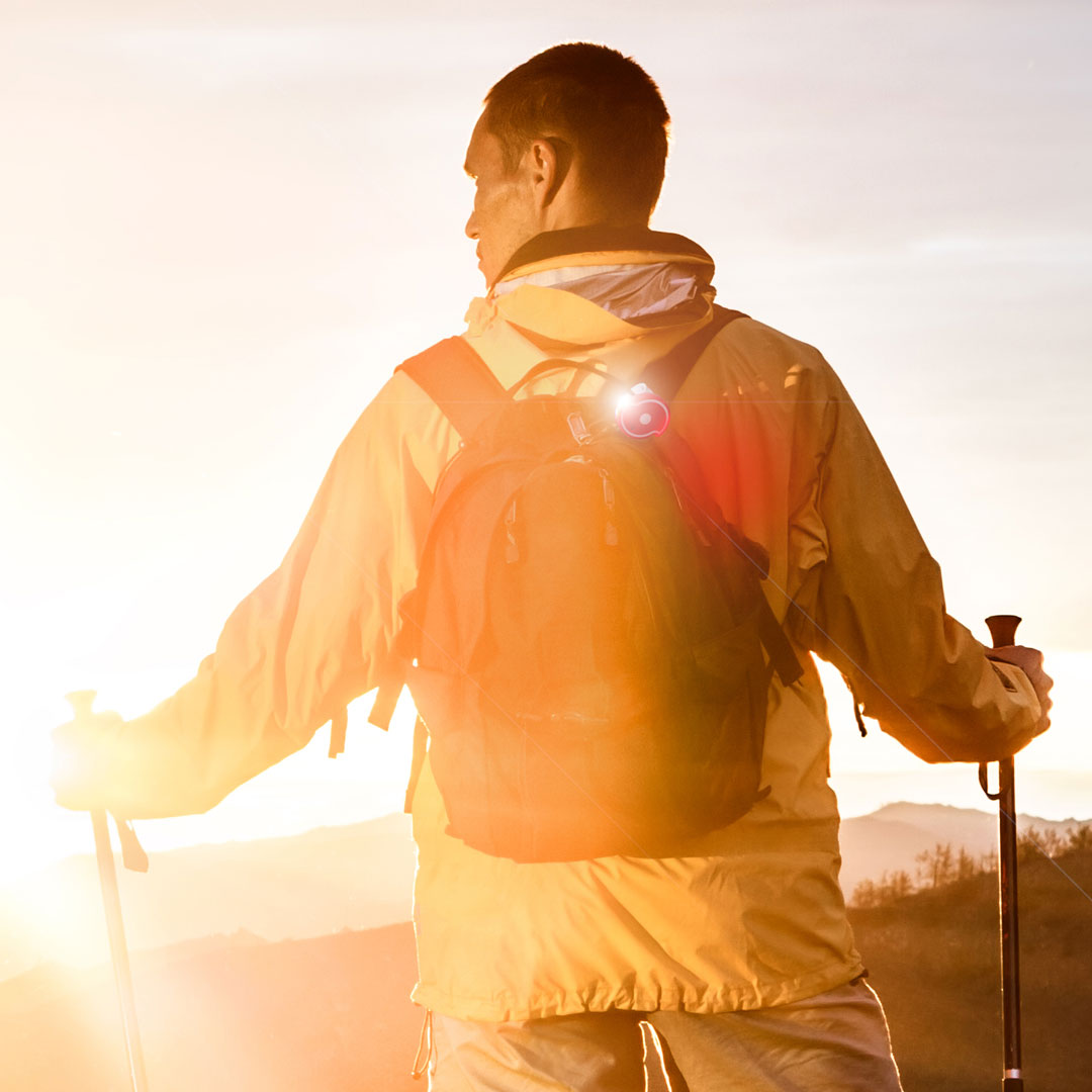 Hiking camper with rotational Twistii attached to rucksack