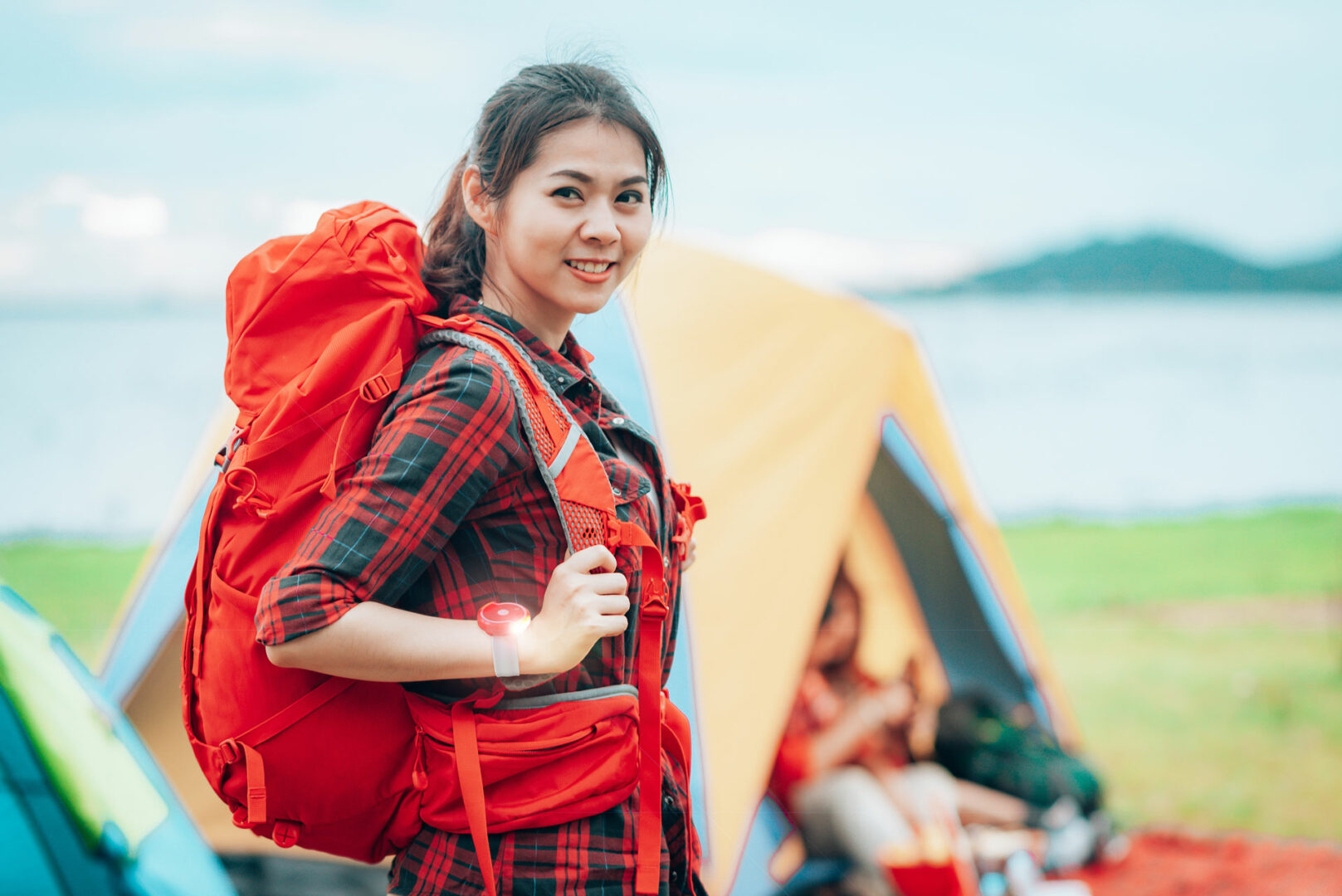 Young woman camping with her Twistii wrist torch on.